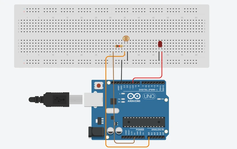 Tinkercad diagram: a resistor from 5V and an LDR to GND joined at A0, and an LED on pin 10