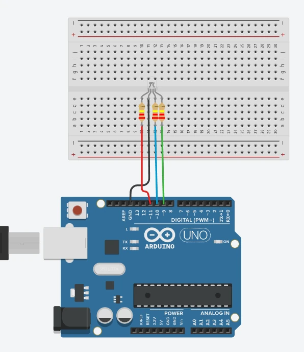 Tinkercad diagram: an RGB LED with its three colour legs on pins 11, 10 and 9 through resistors, and its long leg on GND