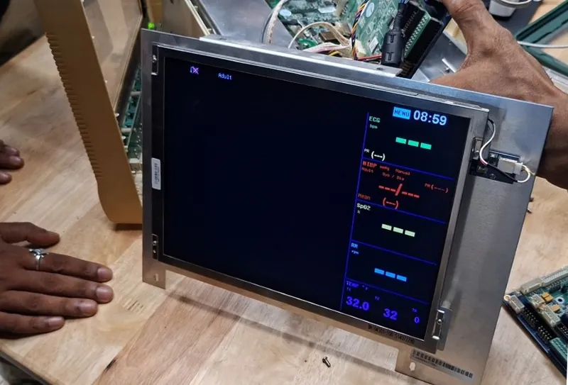 The same bare screen now showing the vitals layout, with panels for ECG, blood pressure, SpO2, respiration and temperature
