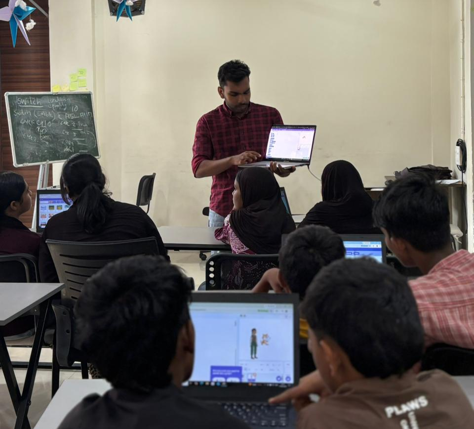 Students building animations using MIT Scratch